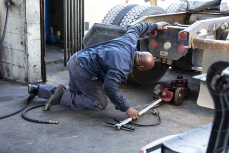 Mechanic works on a semi truck