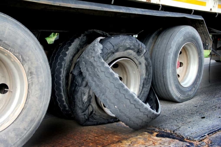 Close up of a tire blowout on a semi truck