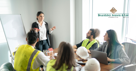 discussing workplace burn injury prevention around a conference table